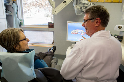 Dr Mac Garrison discussing cerec with a patient