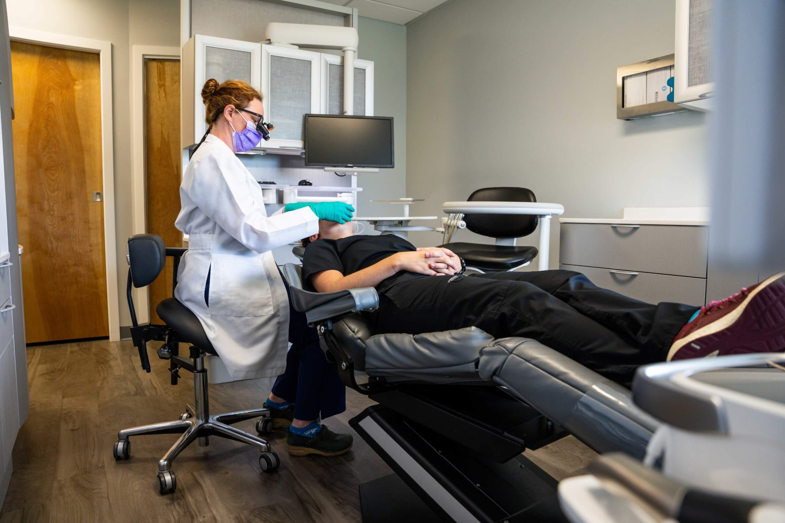 Dentist working on patient