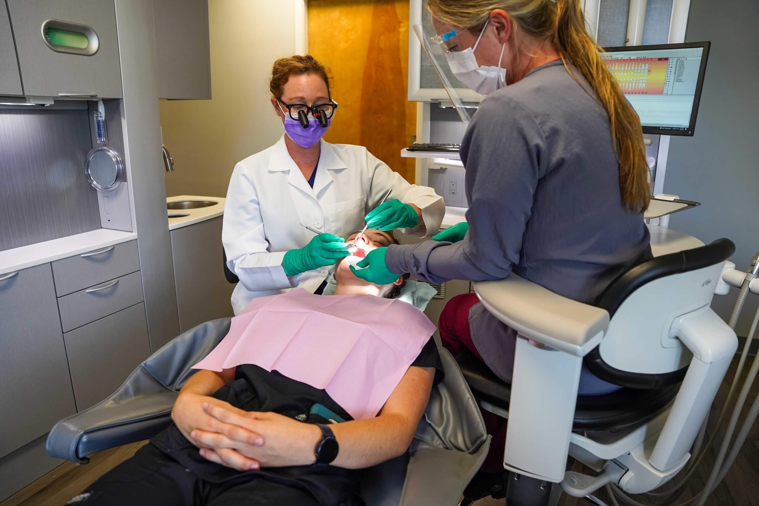 Dentist working on patient