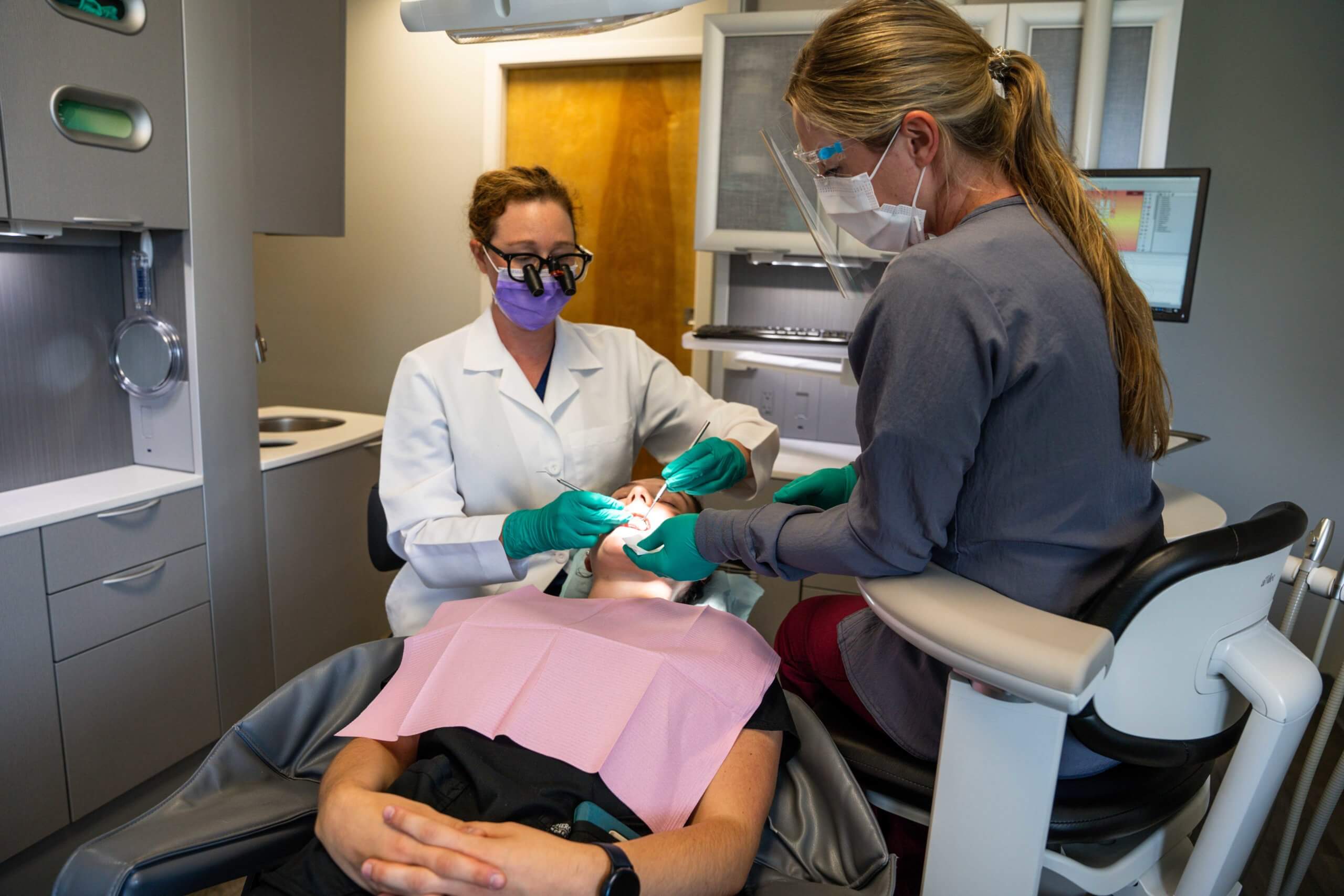 Dentists working on patient