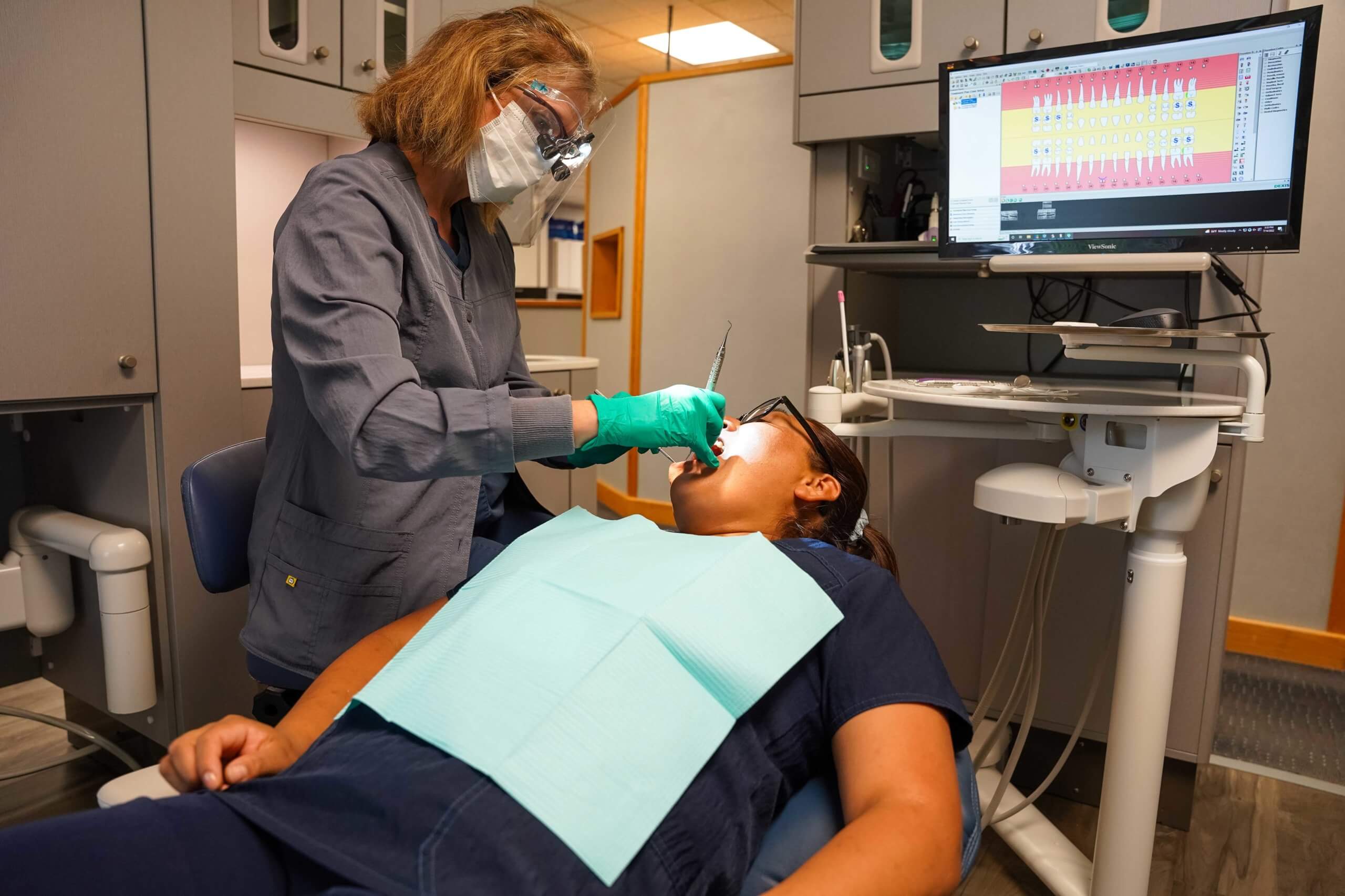 Dentist working on patient