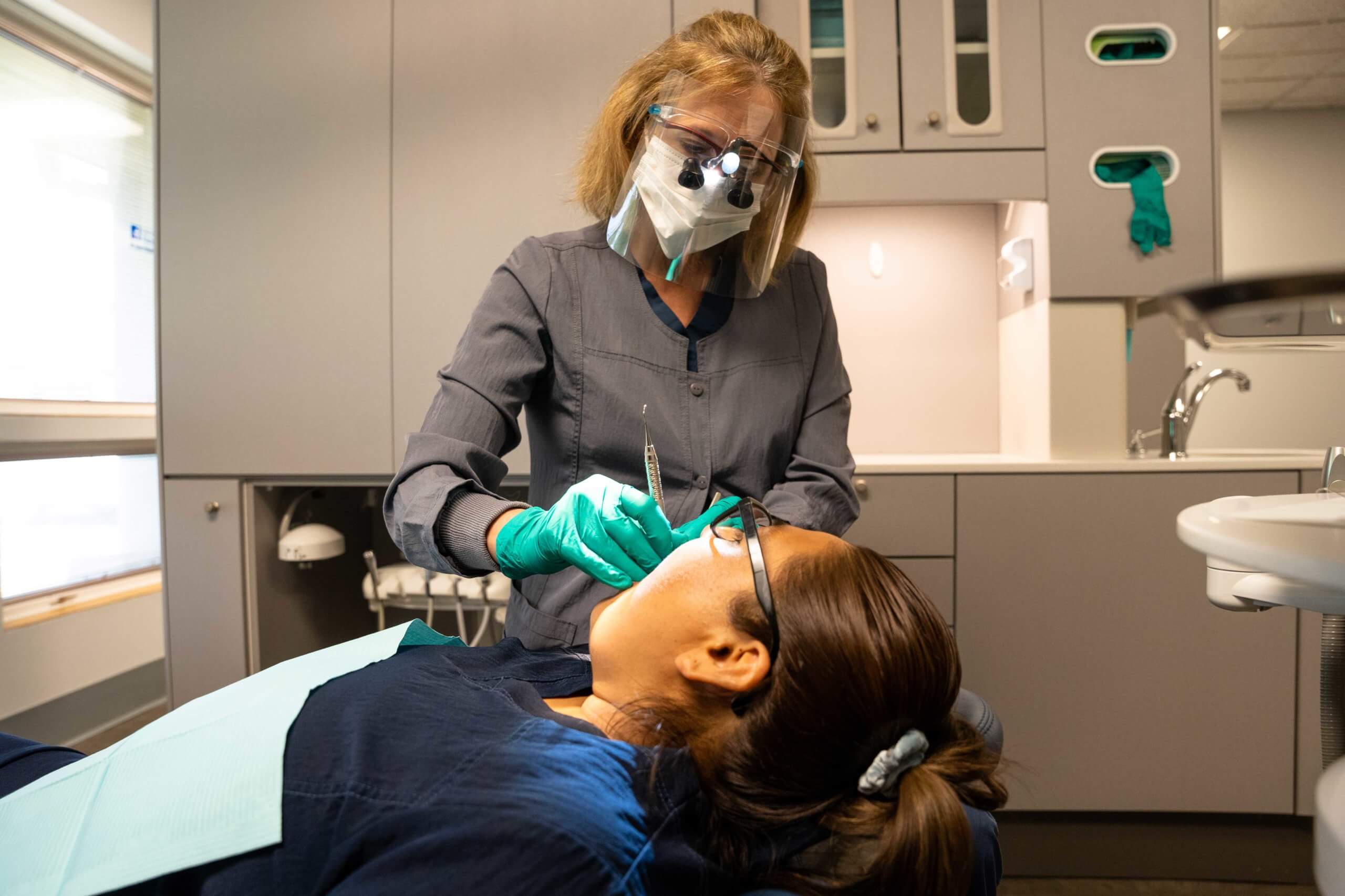 Dentist working on patient