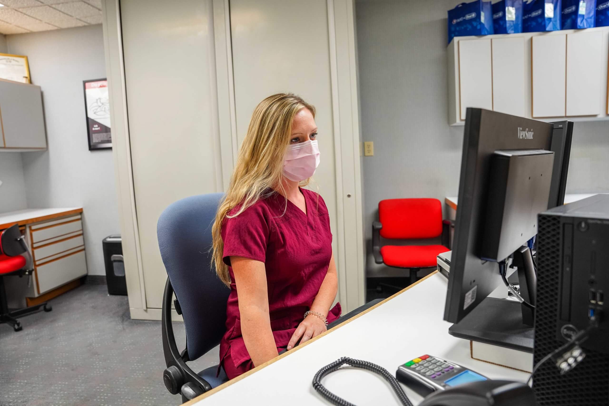 Woman at front desk of Garrison Family Dentistry office